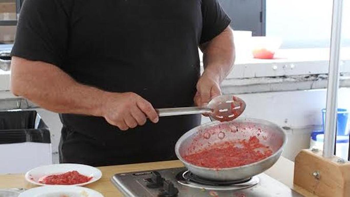 Chef Gregory Scott of Sim’s Pizzeria in Wilmore, demonstrated how to cook beef with Kentucky wine at the Kentucky Wine & Vine Fest.
