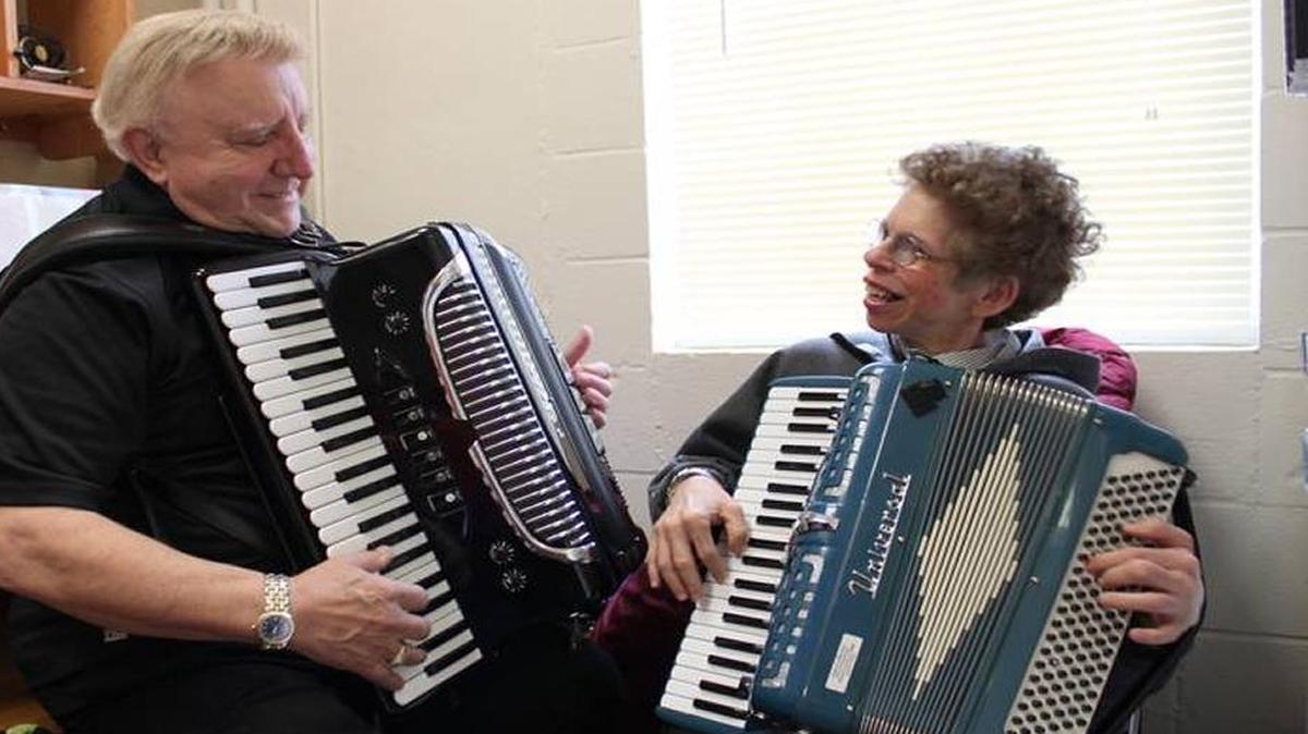 Tony Lovello, left, gave a private accordion lesson to Gloria Lenhoff at Stewart Home School in Frankfort in 2011.