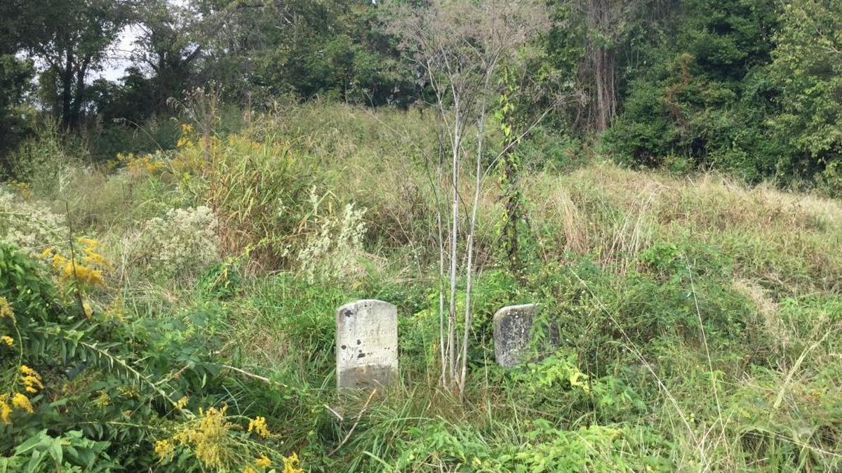 Cemetery A near the Blue Grass Army Depot in Madison County was overgrown before volunteers from First Baptist Church in Richmond started cleaning up on Saturday.