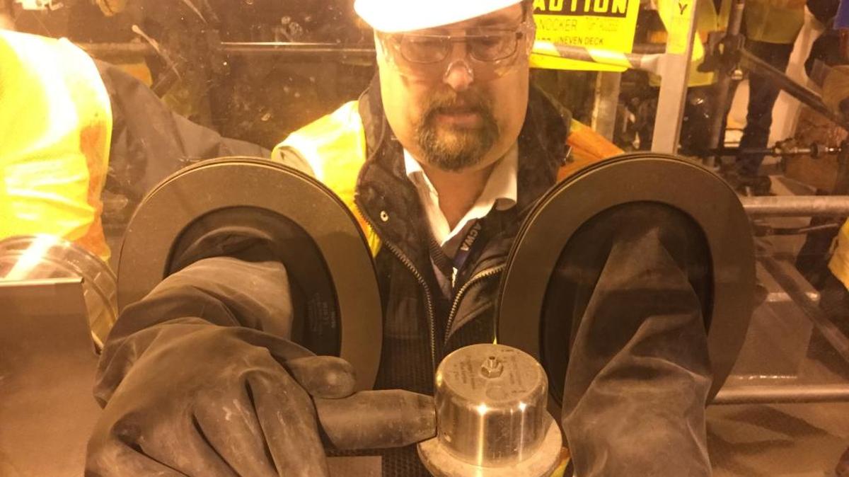 Jeff Brubaker, site project manager at the Madison County plant that will destroy chemical weapons, used the glovebox at the main building where nerve agent will be destroyed.