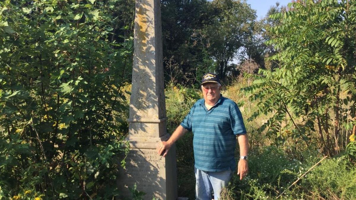 Stewart Davidson, 75, is trying to find help in clearing away the brush from an abandoned Madison County cemetery near Blue Grass Army Depot. More than 900 bodies are buried there.