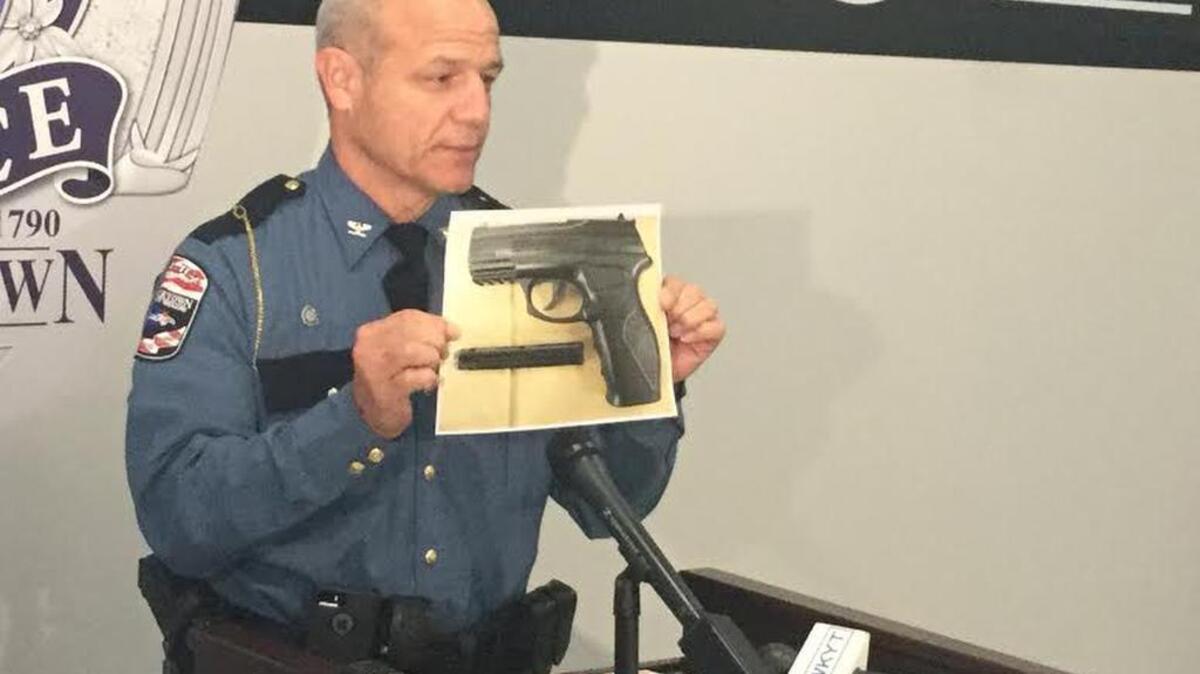 Georgetown Police Chief Mike Bosse holds photo of pellet gun held by Stephen Young