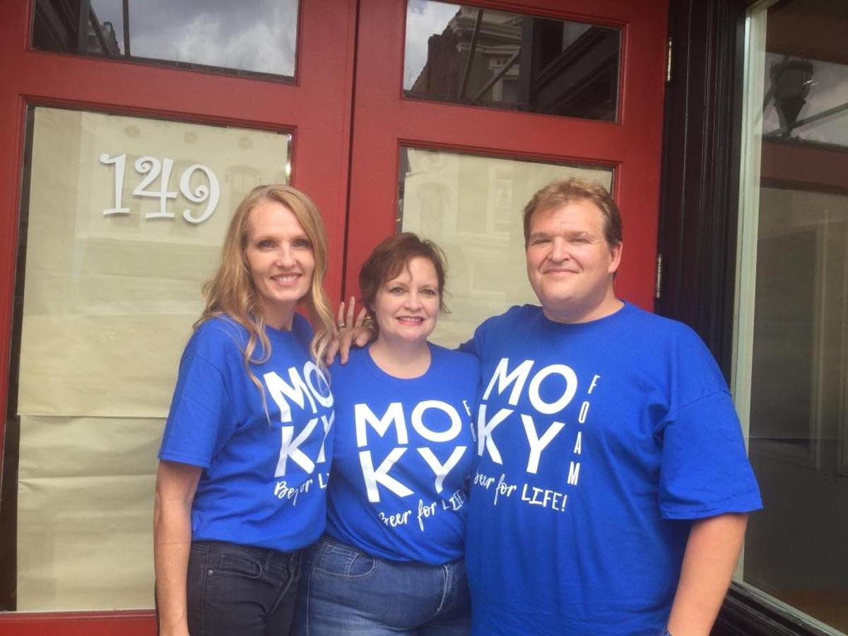 Colleagues Melanie Noe, Synthia Burchell, and her husband Darrin Burchell are three of the four business partners starting My Old Kentucky Foam, a microbrewery slated to open in December on Main Street in Georgetown.