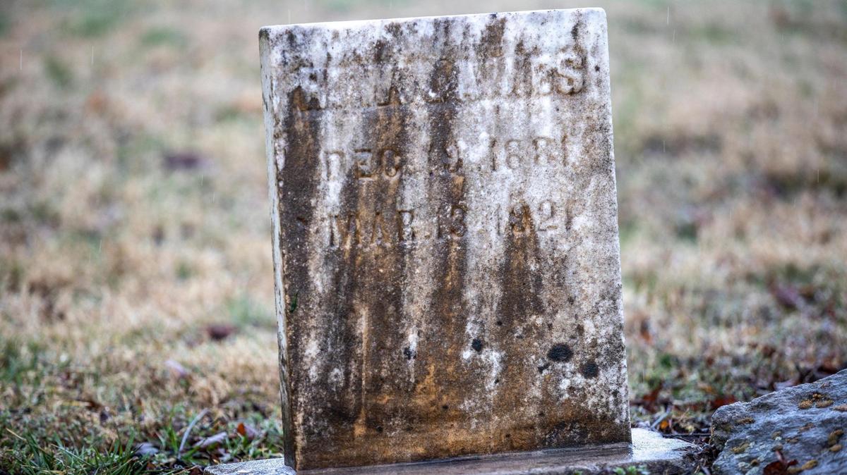 The headstone of Richard W. James, a Black man who was lynched in 1921 outside Versailles, is photographed at his resting place in Midway, Ky., on Friday, March 12, 2021.