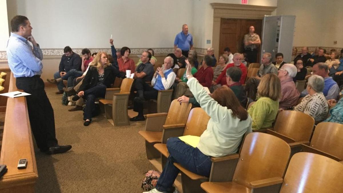 Bill Quigg, left, president of Richmond Baking in Indiana, met with residents Friday to hear their questions and concerns about a new industrial bakery coming to Versailles.
