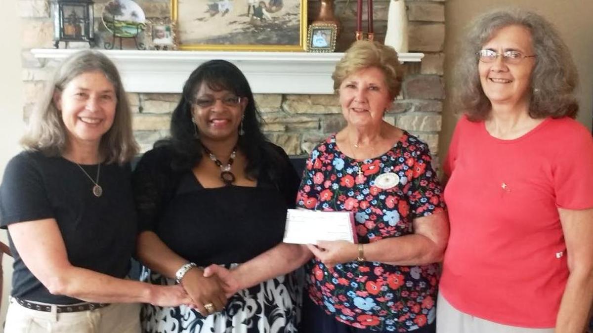 At the August meeting of the International Chapter P.E.O. Sisterhood, an educational grant was awarded to Vera Soules Mabson. The International Chapter P.E.O. Sisterhood is a philanthropic and educational organization that celebrates women helping women. Mabson, who will complete her degree at the University of Kentucky next spring, was sponsored by P.E.O., Chapter S of Versailles. From left are Leslie Penn, Midway; Mabson; Dolores Roberson, chairwoman of the Project for Continuing Education, Lexington; and Nancy Robertson, Frankfort, president of Chapter S.