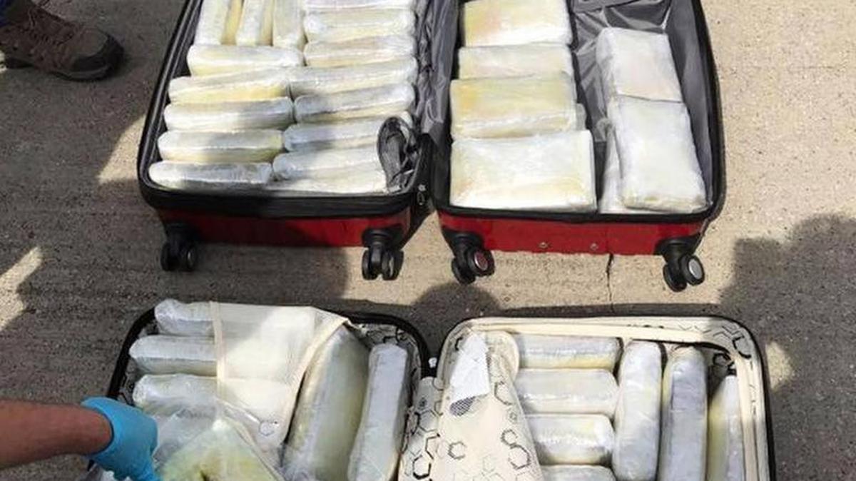 This photo released by Kentucky State Police shows the 40 pounds of meth and 80 bricks of cocaine in luggage that federal and state officials seized at Blue Grass Airport in Lexington on April 21.