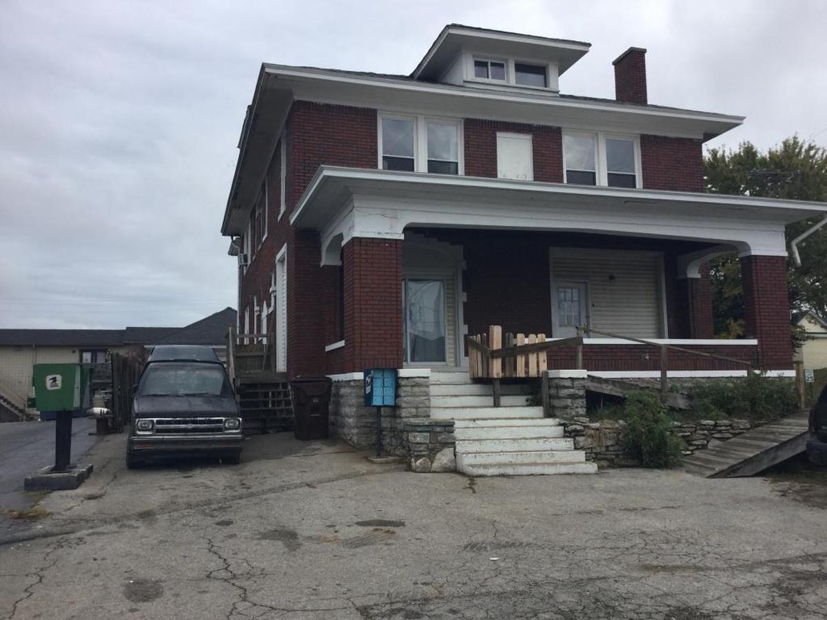Two teenage girls were found shot outside this house on Washington Street in Winchester. One was found near the mailbox at left and another was found by the steps at the side of the house, next to the truck by the house.