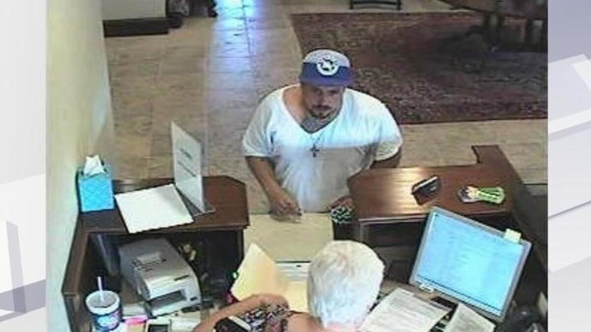 This image was released following the July 20 robberty of the Forcht Bank on New Circle Road. A warrant has been issued for Kelly Ellsworth Cox in that robbery.