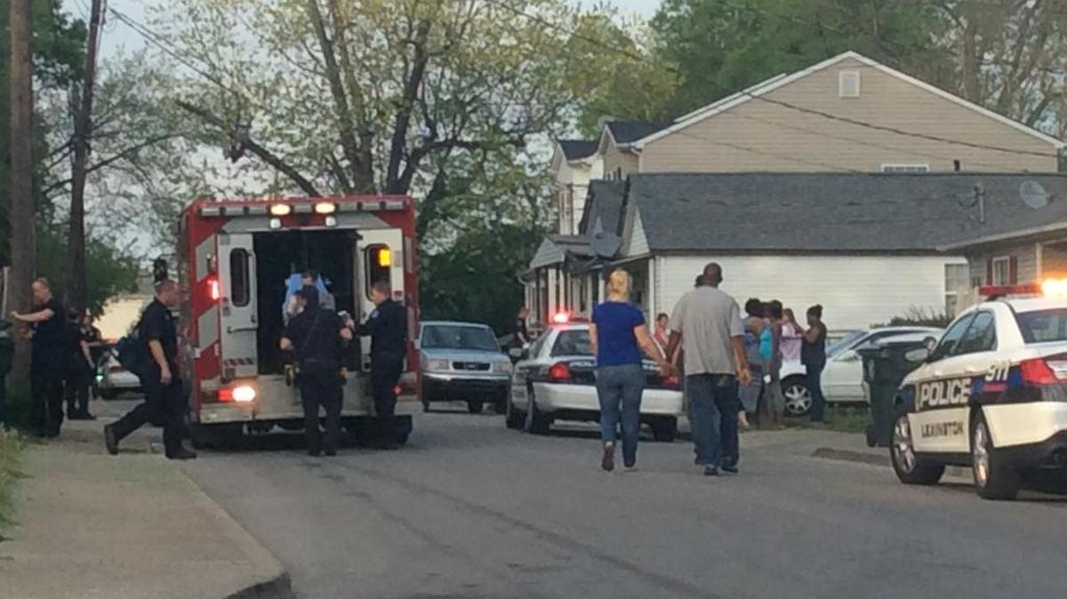 A man was loaded into an ambulance on a stretcher after he was shot at a home on Warnock Street Tuesday night.