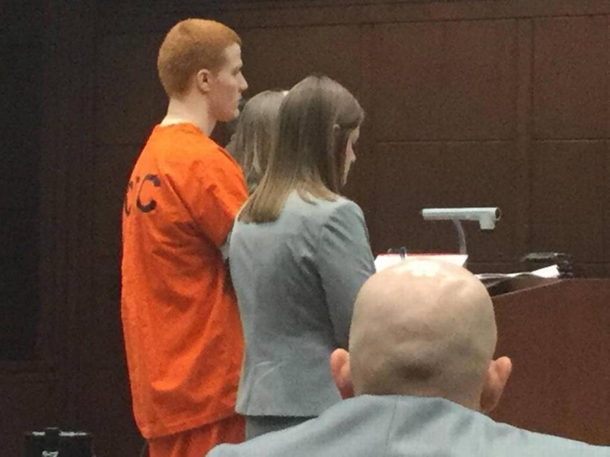 Flanked by attorneys, Travis Bredhold stood before Fayette Circuit Judge Ernesto Scorsone in a hearing in Lexington.