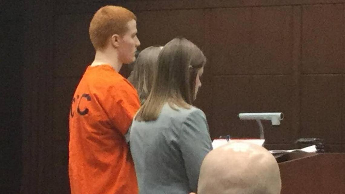 Flanked by attorneys, Travis Bredhold stood before Fayette Circuit Judge Ernesto Scorsone in a hearing in Lexington.