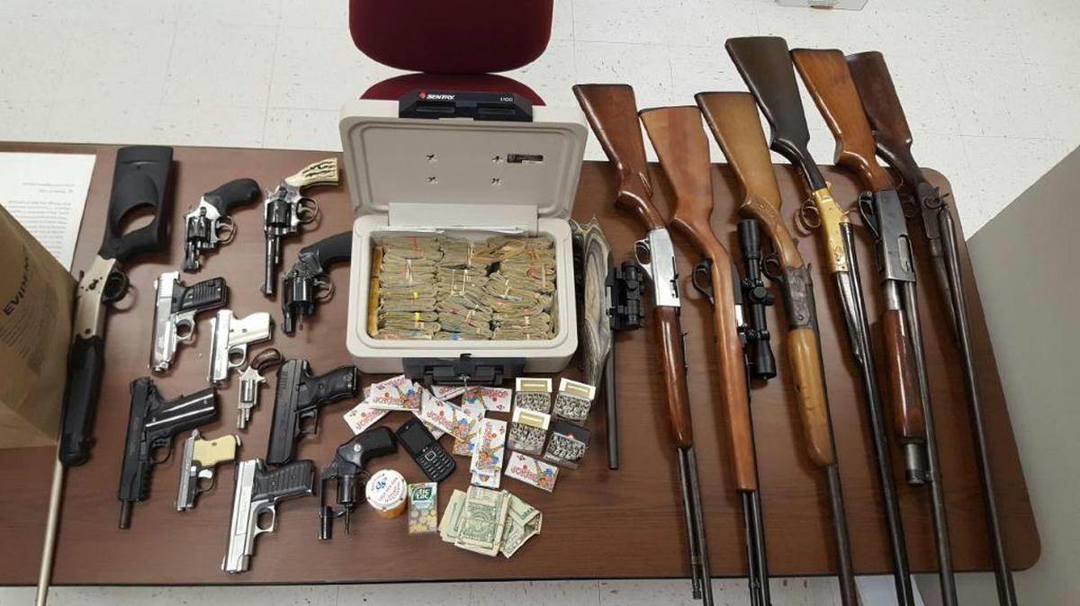 These 19 firearms and bundles of cash were seized last week by Richmond police during a search.