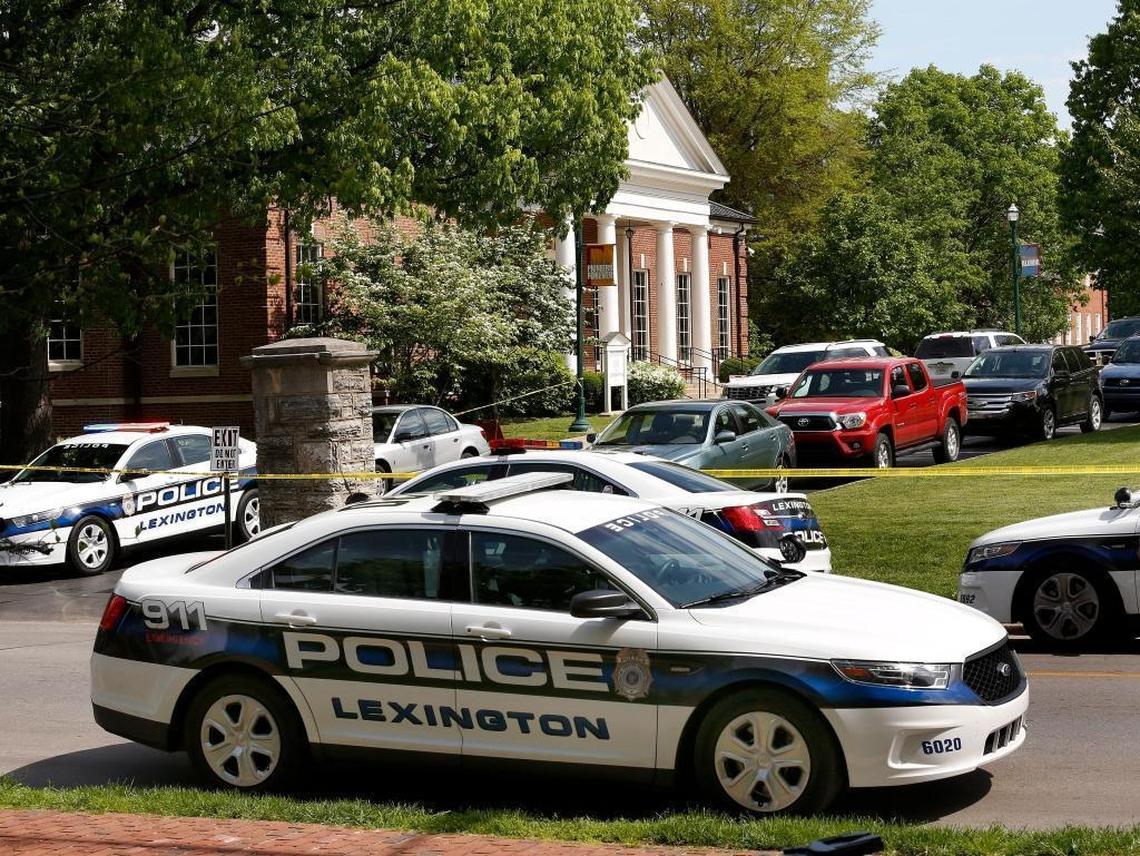 Lexington police officers remained at Transylvania University for hours after a man armed with a machete and knives entered a campus coffee shop inside the Glenn building, at left, and attacked at least one person. A suspect, thought to be a former student, was arrested.