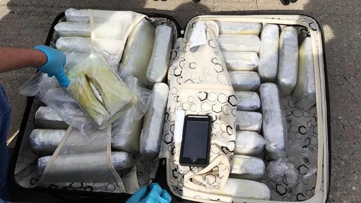 This photo released by Kentucky State Police shows the 40 pounds of meth and 80 bricks of cocaine in luggage that federal and state officials seized at Blue Grass Airport April 21.