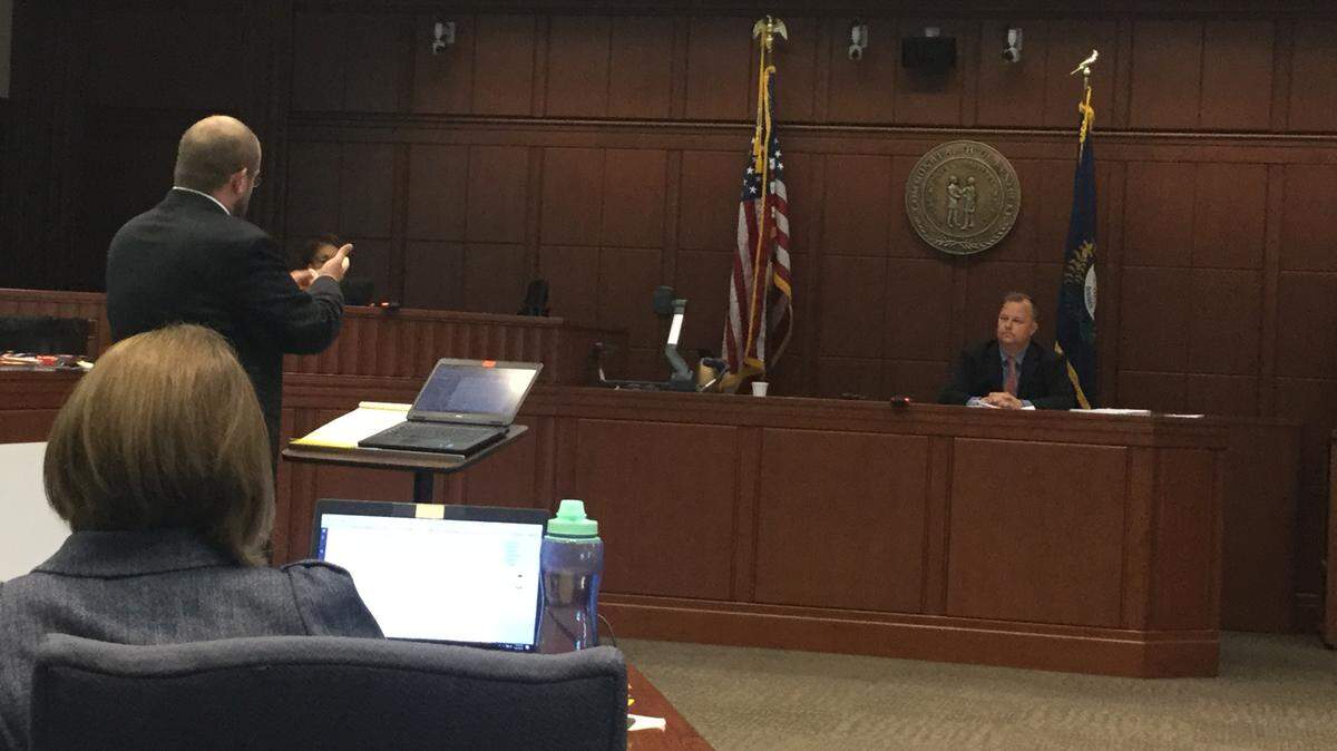 Defense attorney Chris Tracy, left, cross-examined Lexington detective Franz Wolff during his testimony in the trial of Quincinio Canada and Dawan Mulazim, who are accused of murdering Marine Jonathan Price and wounding Price's wife, Megan.