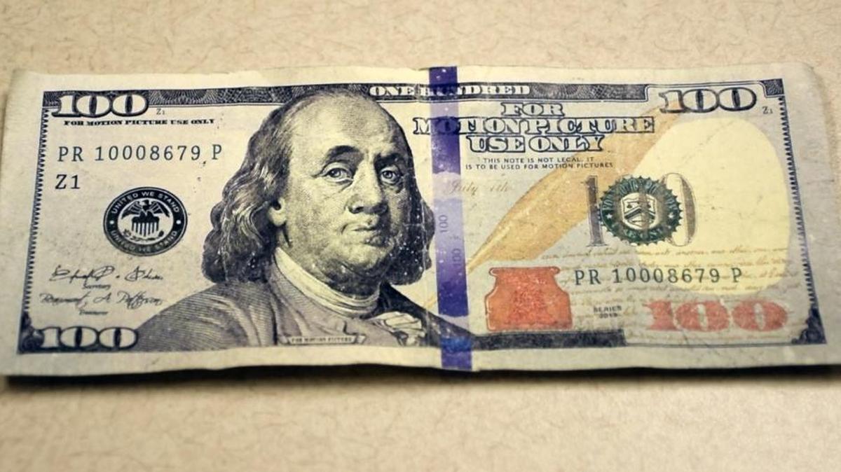 The counterfeit bill is inscribed “for motion picture use only” near the top of the bill and to the right of Benjamin Franklin’s head.
