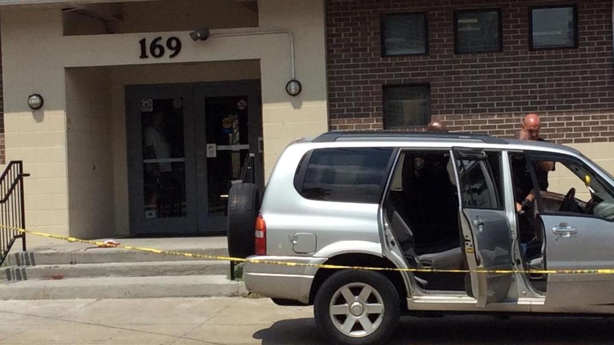 Police investigated outside St. James Place Apartments on Deweese Street Saturday, where a man went for help after being shot in the head inside this vehicle.