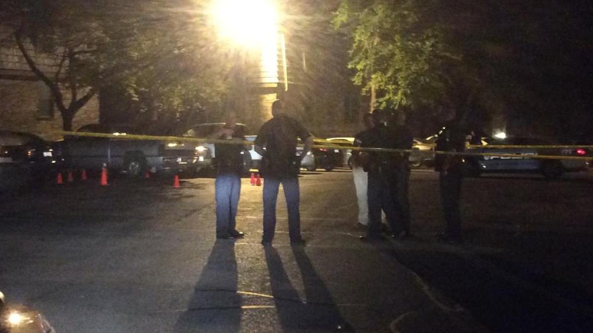 Officers gathered at the scene of a shooting at Pegasus Place apartments Thursday night.