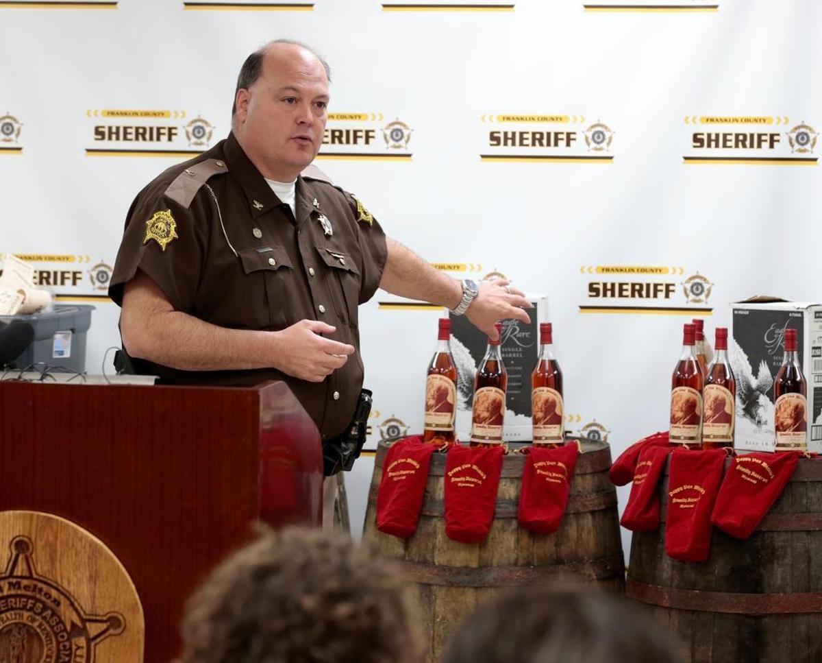 Franklin County Sheriff Pat Melton, with bottles of recovered Pappy Van Winkle’s Family Reserve 20-year-old bourbon in the background, talked about indictments in a theft ring during a news conference April 21, 2015, Frankfort. The thefts targeted the Buffalo Trace and Wild Turkey distilleries and included Pappy Van Winkle bourbon.