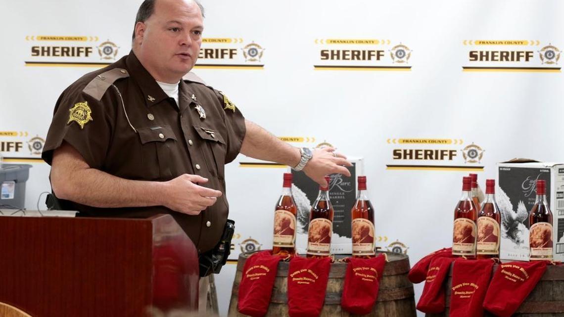 Franklin County Sheriff Pat Melton, with bottles of recovered Pappy Van Winkle’s Family Reserve 20-year-old bourbon in the background, talked about indictments in a theft ring during a news conference April 21, 2015, Frankfort. The thefts targeted the Buffalo Trace and Wild Turkey distilleries and included Pappy Van Winkle bourbon.