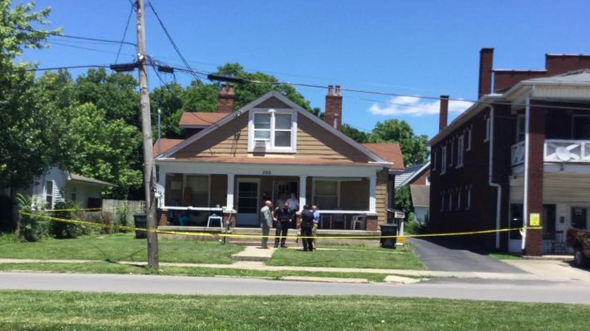 Investigators worked at the house where two people were injured in an assault with a knife on East Loudon Avenue.