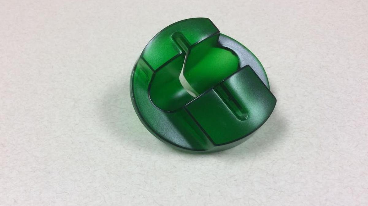 An ATM skimmer that resembles a cover to a card reader hides components that store credit card information.