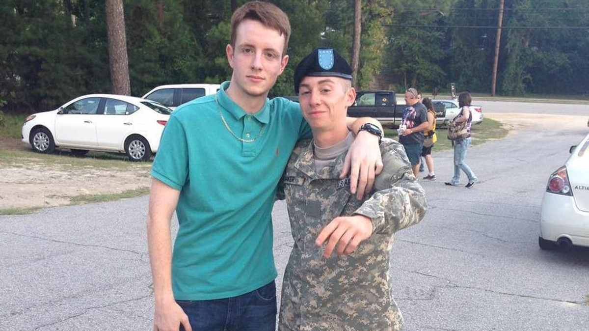 Caleb Hallett, left, posted a picture on Facebook in August with friend Josh Baker, who was injured in the shooting that killed Hallett.