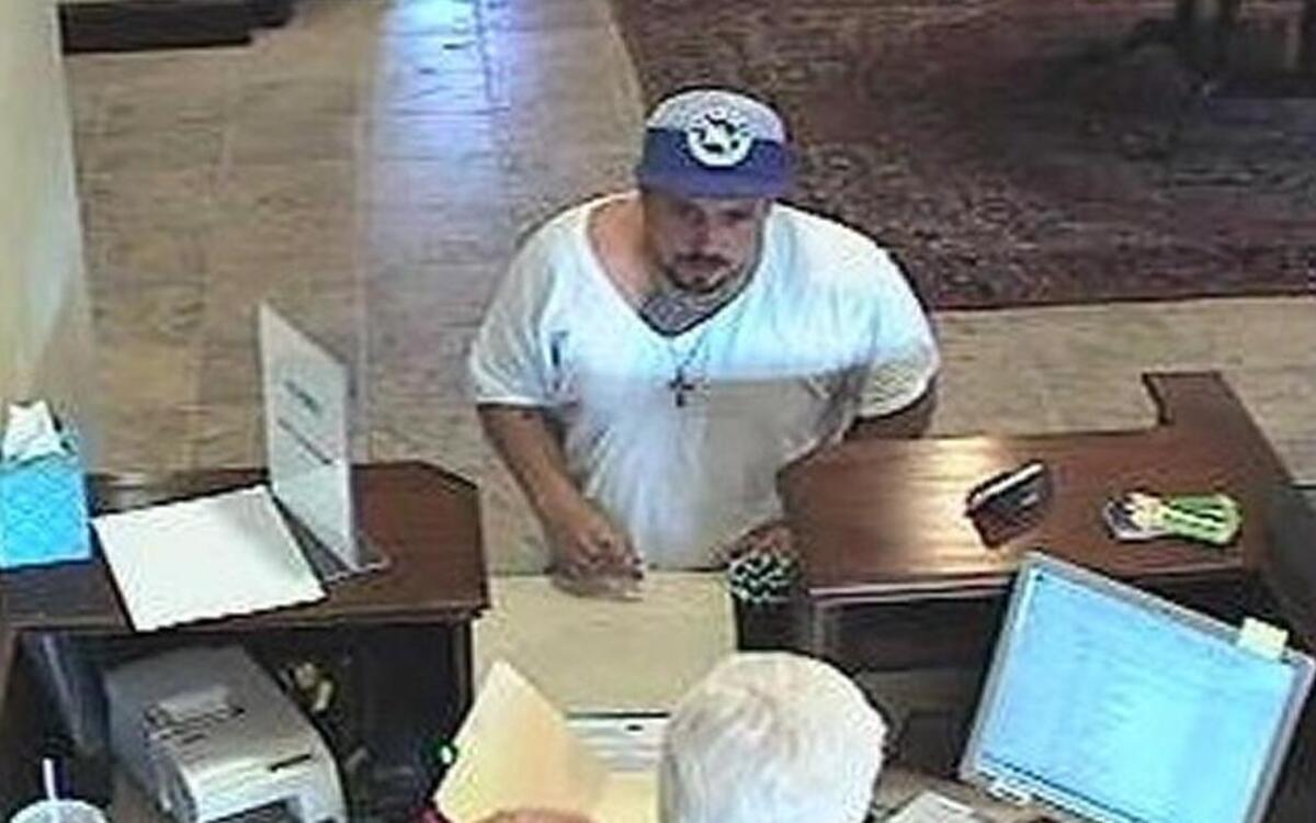 Security footage of the suspect in a robbery Wednesday morning at Forcht Bank on West New Circle Road.