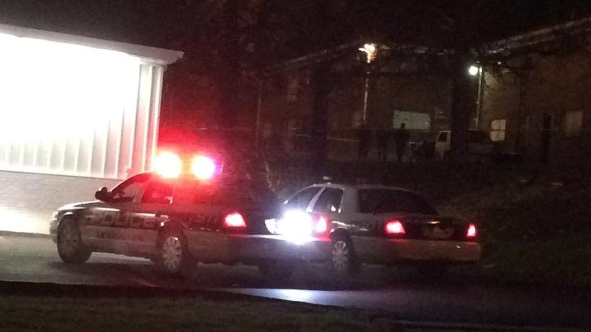 Police said a stolen SUV was used in a robbery and then hit two apartment buildings on Alexandria Drive. The SUV is in the background.