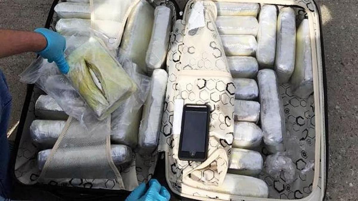 This photo released by the Kentucky State Police showed the 40 pounds of meth and 80 bricks of cocaine in luggage that federal and state officials seized at Blue Grass Airport April 21, 2017.