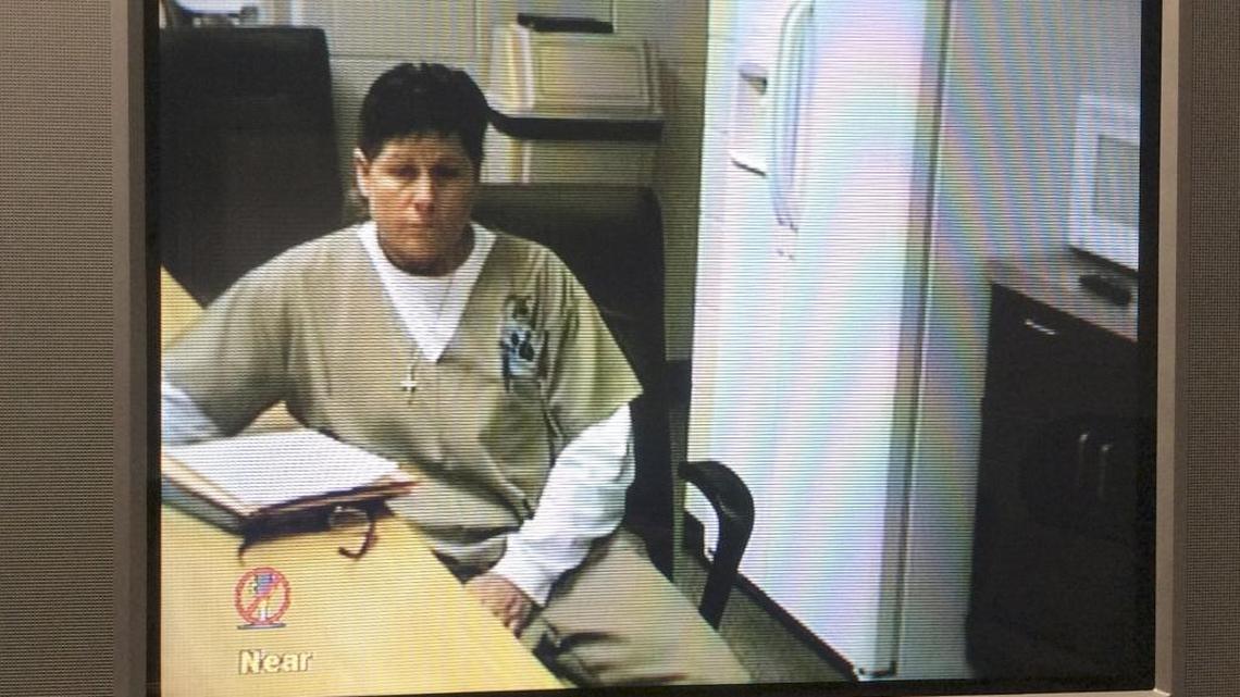 Karen Brown talked with a two-member parole board panel Tuesday in an image captured from video.