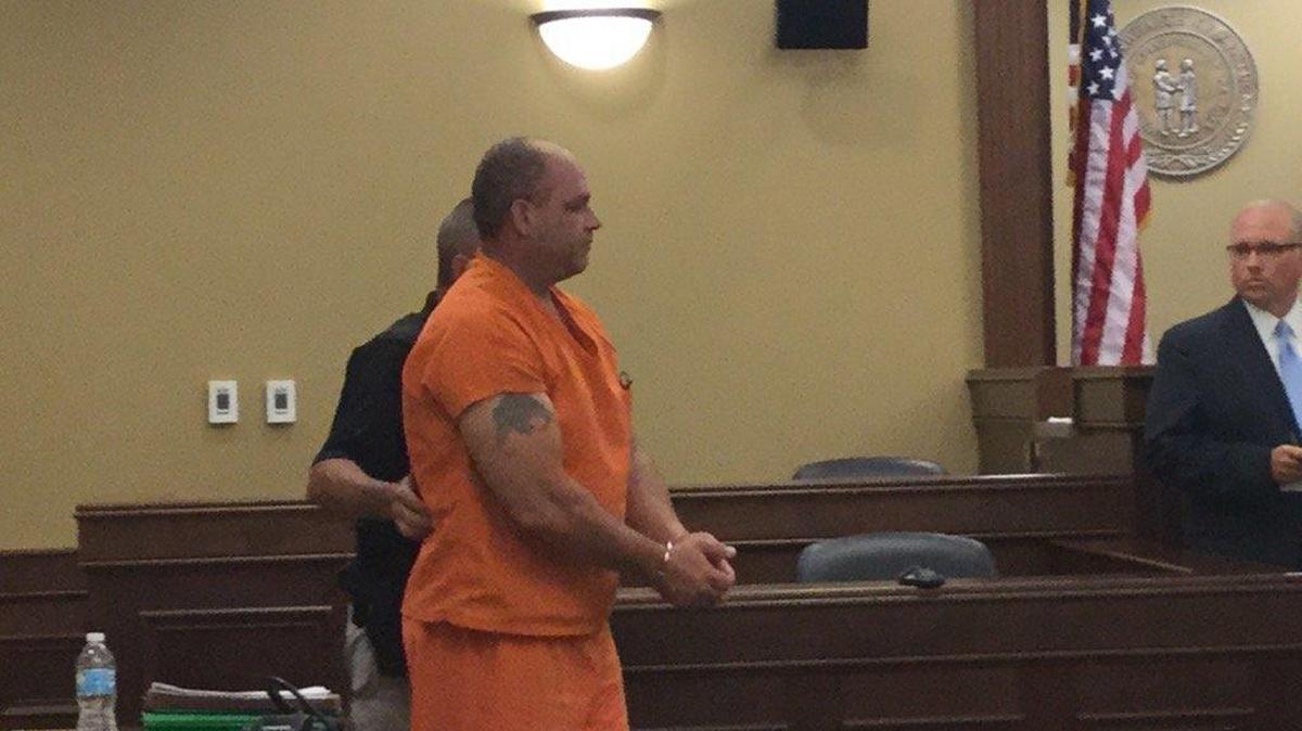 Craig Pennington, 52, charged in the murders of a Northern Kentucky couple, enters a not guilty plea in court in Springfield.