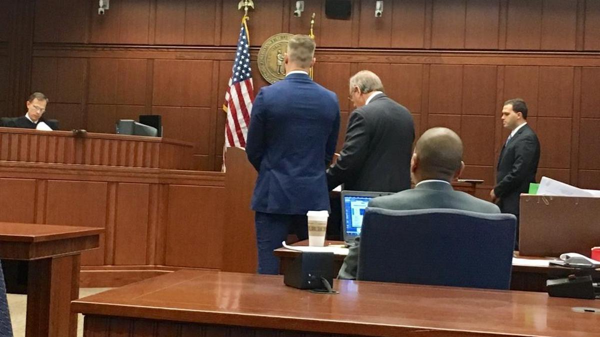 Michael Poe (center) pleaded guilty Friday in front of Fayette Circuit Judge Thomas Travis Friday in Fayette County Circuit Court.