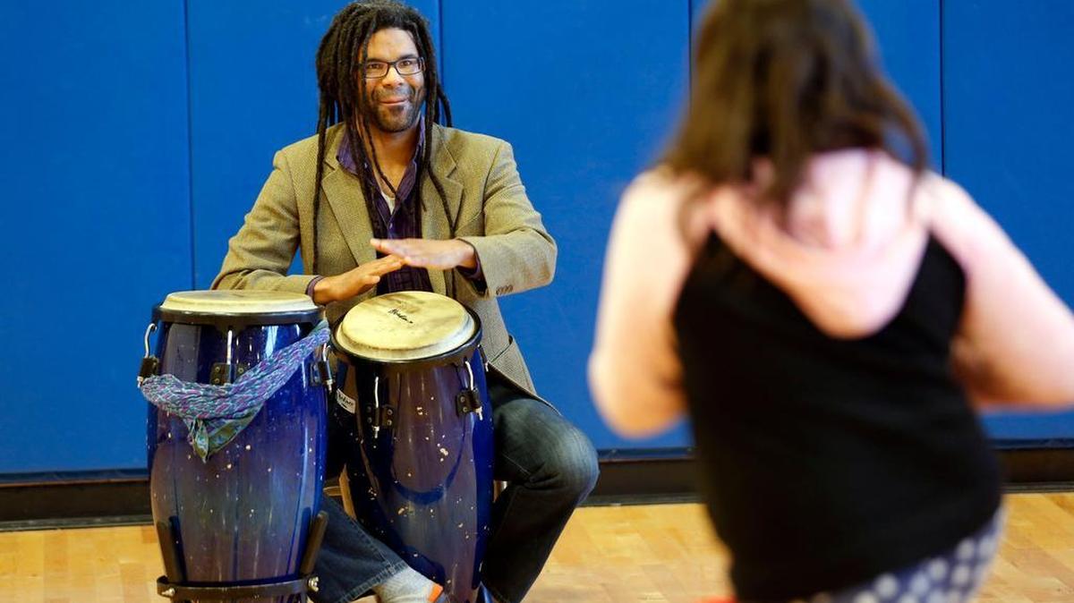 Musician Marcus Wilkerson played conga drums and Breckinridge Elementary School students danced to the rhythms recently. Wilkerson and Jeana Kleven, founder and artistic director of the Allegro Dance Project, worked with the kids on various dance movements.