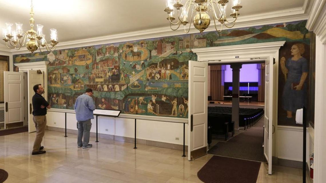 Clay Bunn, left, and Phil Ray took a moment to look at the recently unveiled mural by Ann Rice O'Hanlon in Memorial Hall on the University of Kentucky campus in Lexington, Ky., on March 24, 2017. 