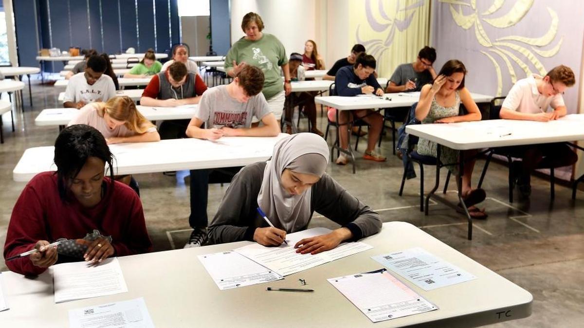 A group of Tates Creek High School students in the International Baccalaureate Programme took a final exam Thursday at Pax Christi Church in Lexington.