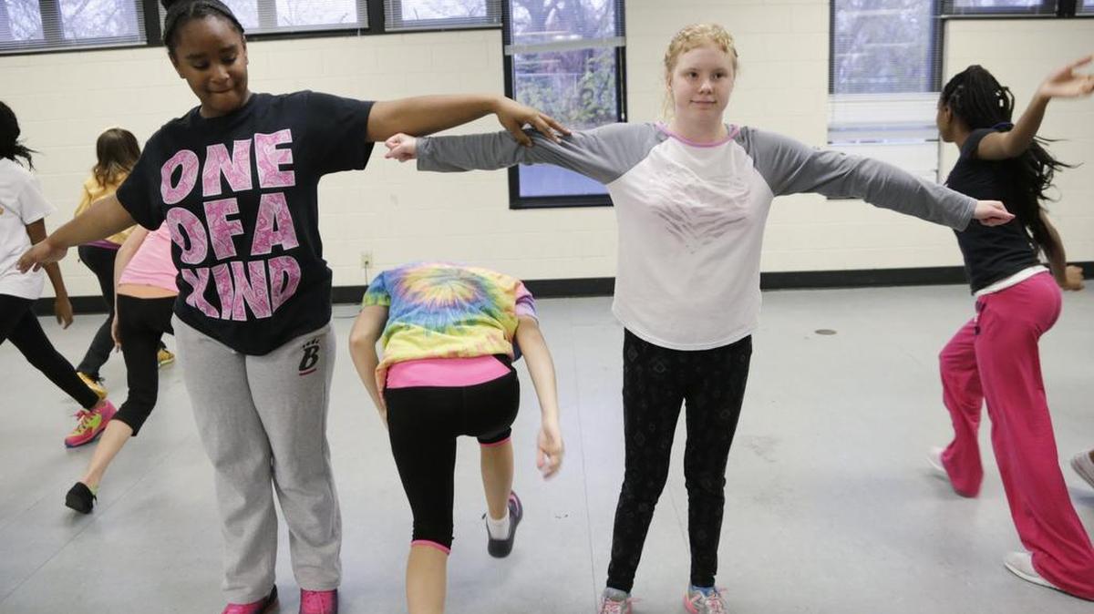Bailey Locker, right, with teammates including Lauran Owen-Mundy, left, and Katherine Kincaid, center, practiced during a dance team rehearsal at Bryan Station Middle School on Dec. 3.