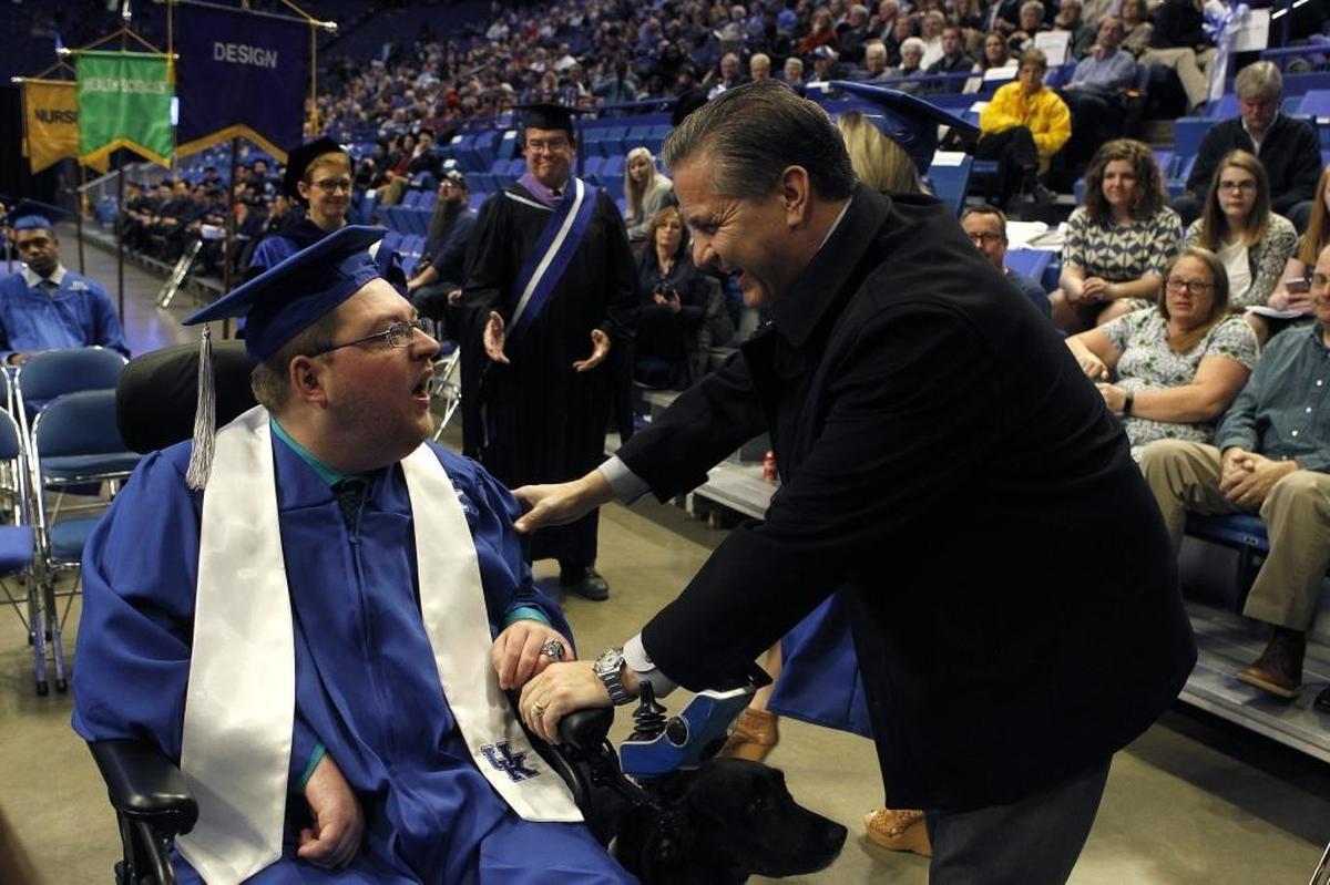UK men's basketball coach John Calipari congratulated the team's student manager, Kevin Massey, after he was awarded his bachelor's degree. December commencement exercises for the University of Kentucky were Friday at Rupp Arena.