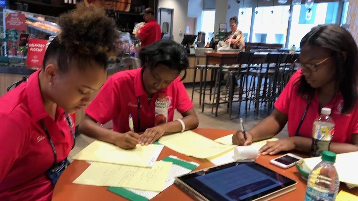 Shana Berryman, Shermane Cowans and Te’Osha Raglin on Friday made last minute adjustments to their presentation on the death of friend Trinity Gay for a national conference in Colorado.