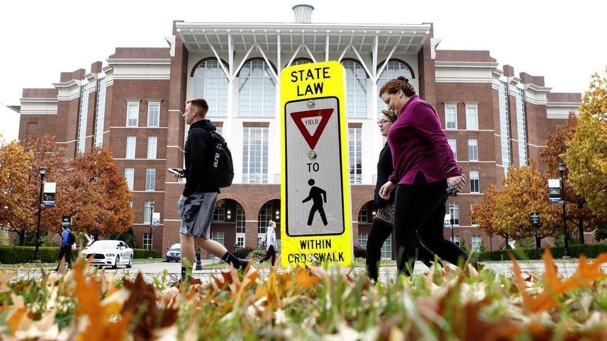 People cross at the intersection of University and Hilltop avenues across from the W. T. Young Library in Lexington, Ky., Monday, November 6, 2017.