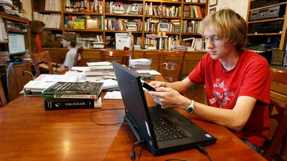 Joseph Lindemuth, left, and his brother, Benjamin Lindemuth, did school work in their home in Lexington on March 3, 2017.
