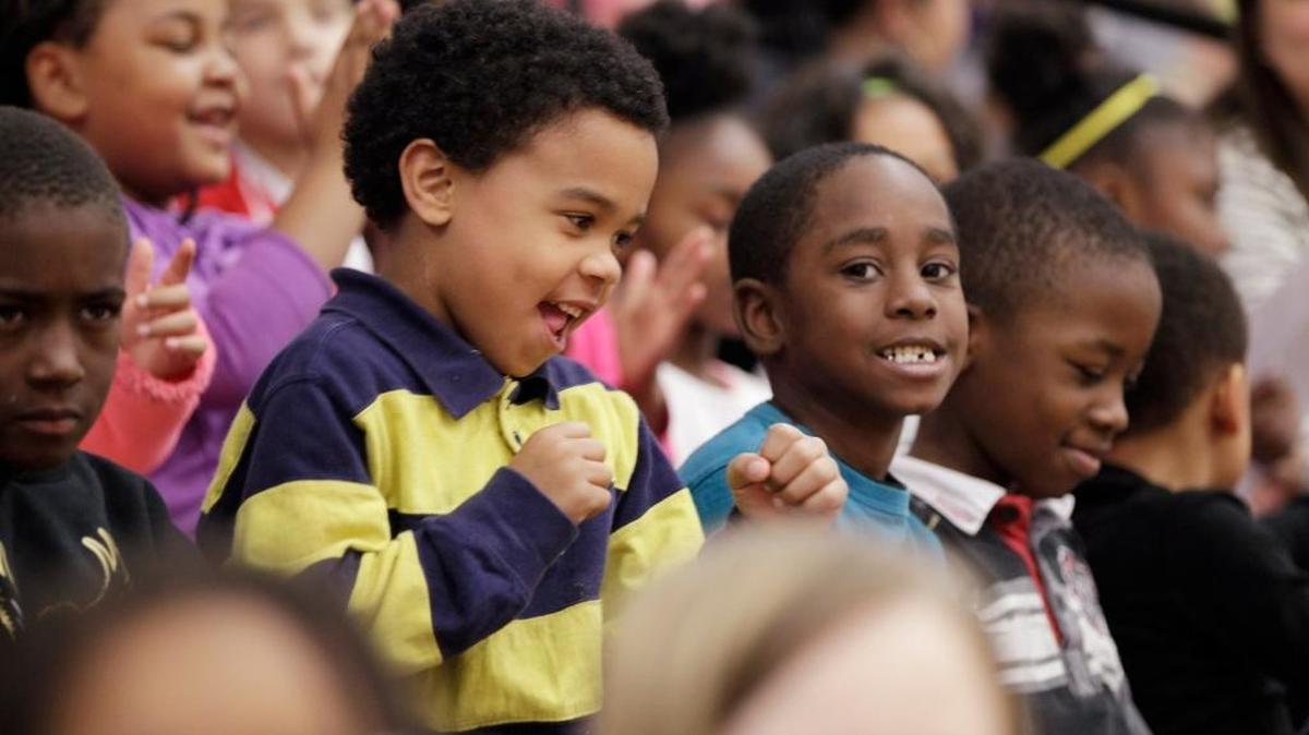 Aaron Woods, a first-grader, danced during a pep rally Monday hosted by the United Way at William Wells Brown Elementary School.