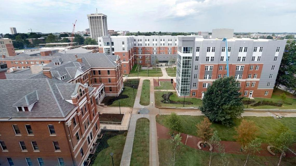 A view of Holmes Hall, back and right, one of two new residence halls opening this semester on the University of Kentucky campus at the intersection of Avenue of Champions and South Limestone in Lexington, Ky., Thursday, August 9, 2016. Holmes Hall and Boyd Hall will reopen in new buildings this fall. on the left is Patterson Hall.
