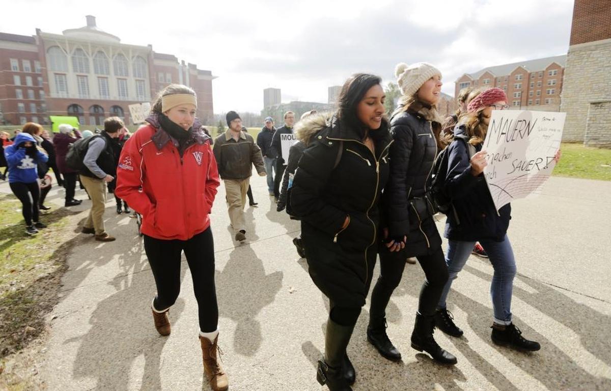 A march to support international students and protest President Donald Trump’s immigration ban passed the William T. Young Library on the University of Kentucky campus in Lexington, Ky., on Feb. 9, 2017.