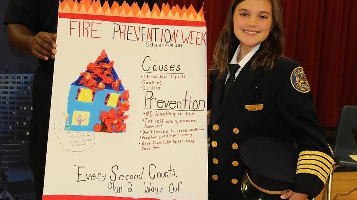 Meadowthorpe Elementary’s Katie Bowden, shown with her winning poster, will represent Lexington schoolchildren as the city’s 2017-18 junior fire chief, an honorary year-long position.