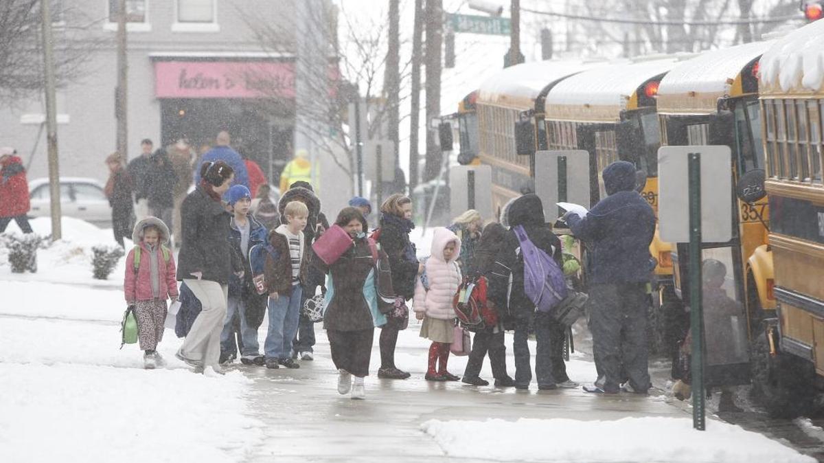 Students board the buses at Maxwell Elementary as heavy snow fell throughout the day in Lexington, Ky., Tuesday, February, 03, 2009. Snow started falling in Lexington around 9 a.m. Fayette County Schools dismissed an hour early today due to the snow.