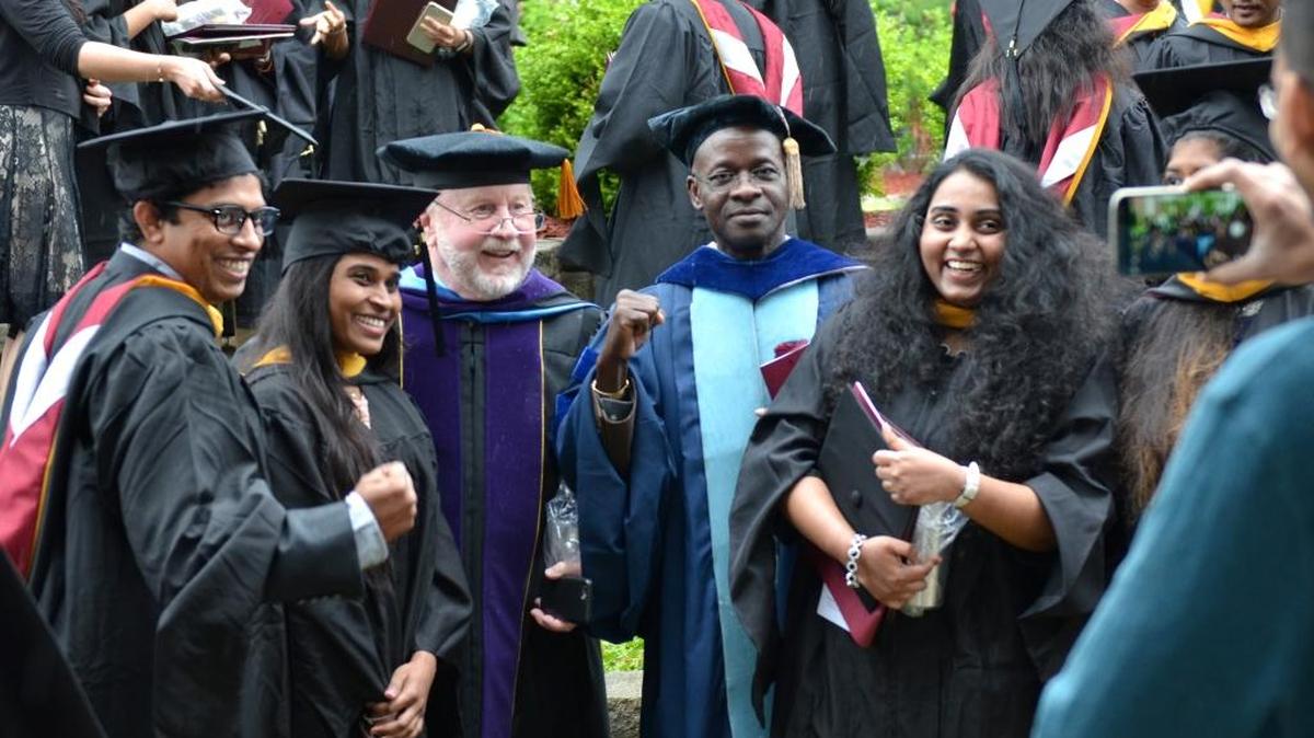 Master of Science in Information Technology and Management graduates took photos with their professors after the commencement ceremony at Campbellsville University’s Ransdell Chapel. From left are Sai Kiran Gadde; Srilekha Allamsetty; Bruce Singleton, assistant professor of business; Sunny Onyiri, professor of business and accounting and director of the business program at Louisville Education Center; and Nikhita Pavani.