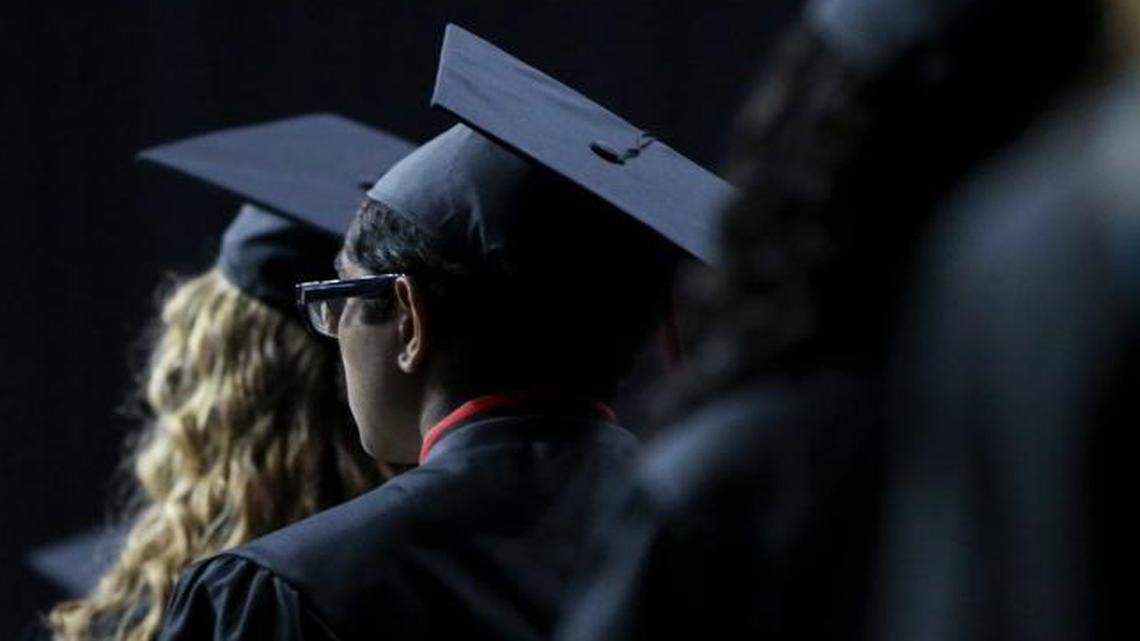 Students file in line preparing to take their seat during the Paul Laurence Dunbar graduation ceremony at Rupp Arena on Wednesday, May 24, 2017 in Lexington, Ky.