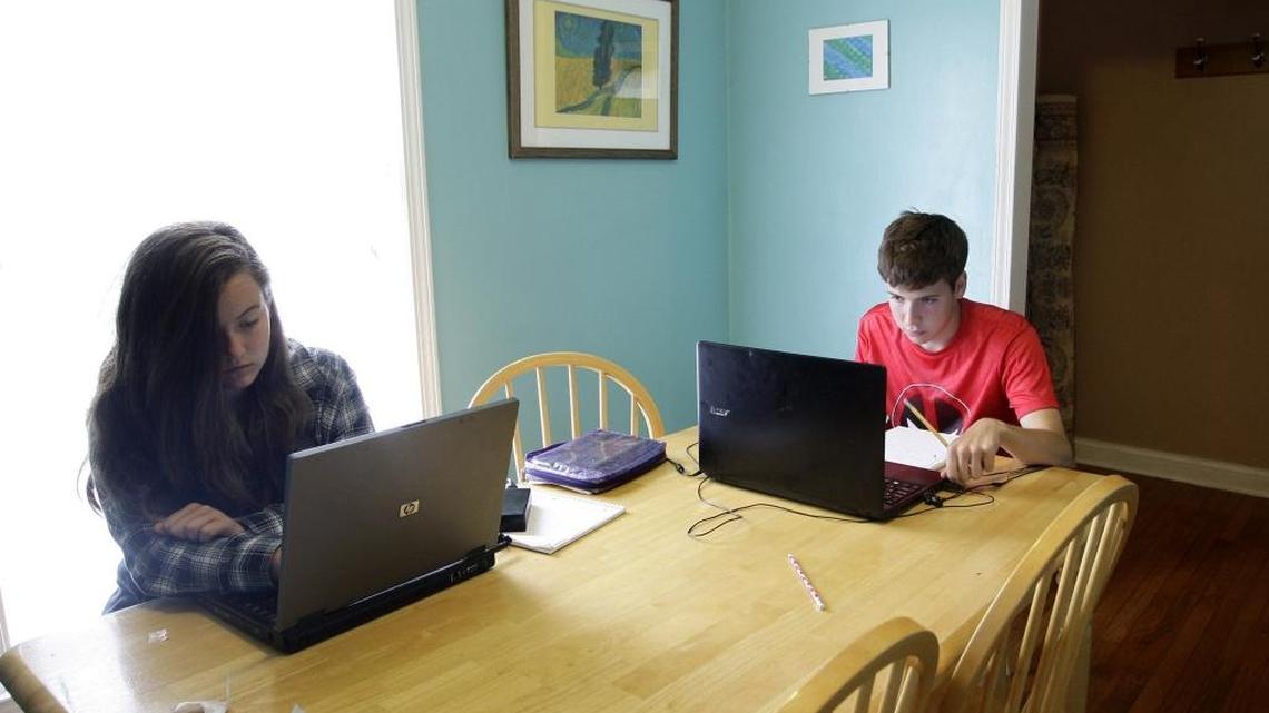 Linda Denny’s children, Olivia (15) and Matthew Denny (18), worked on schoolwork for their virtual classes last week.